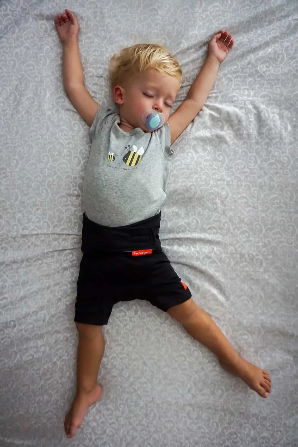 toddler sleeping wearing peepeepants