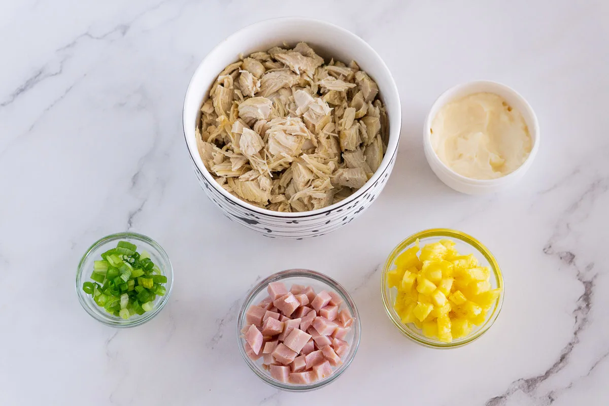 ingredients for Hawaiian chicken salad - pineapple, ham, scallion, mayo