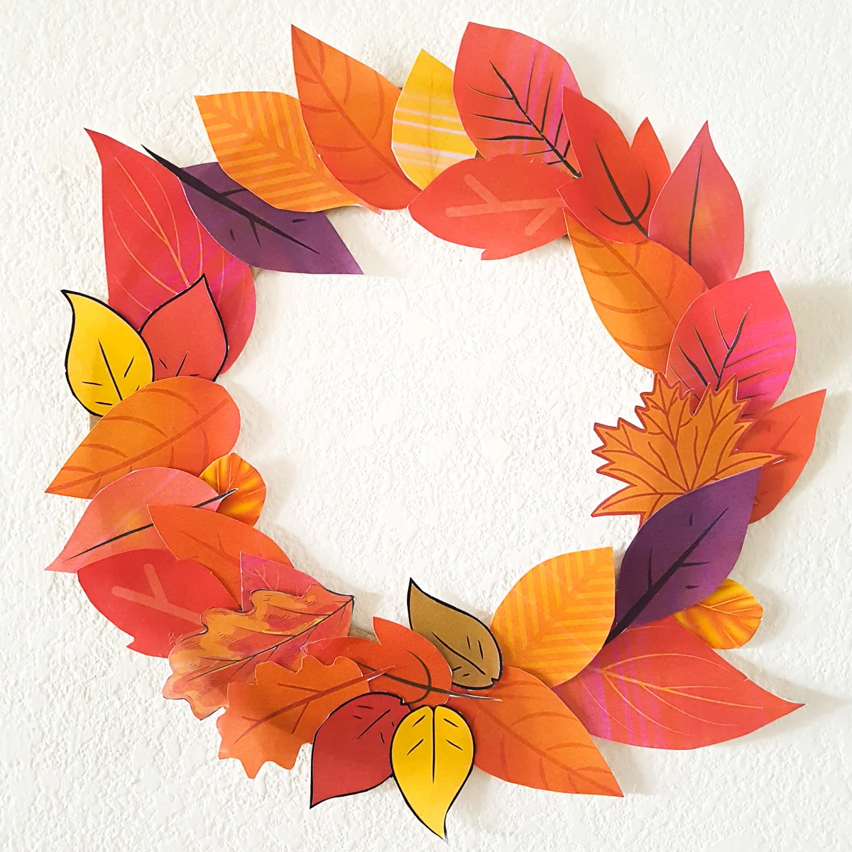 fall wreath made of paper leaves toddler craft