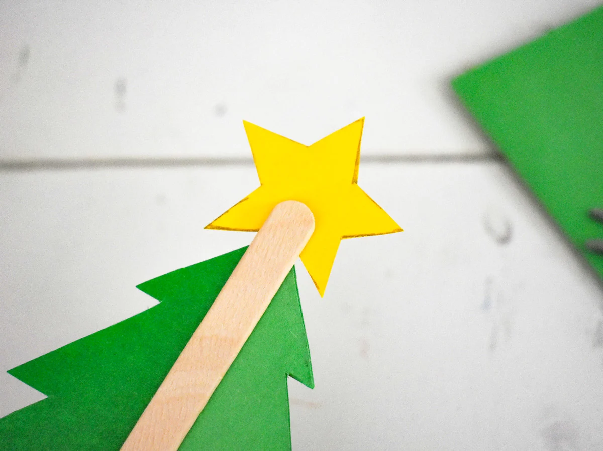 cardstock christmas tree glued to a craft stick