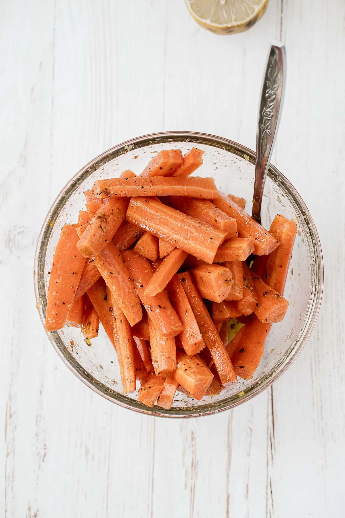 Seasoned carrots in a bowl.