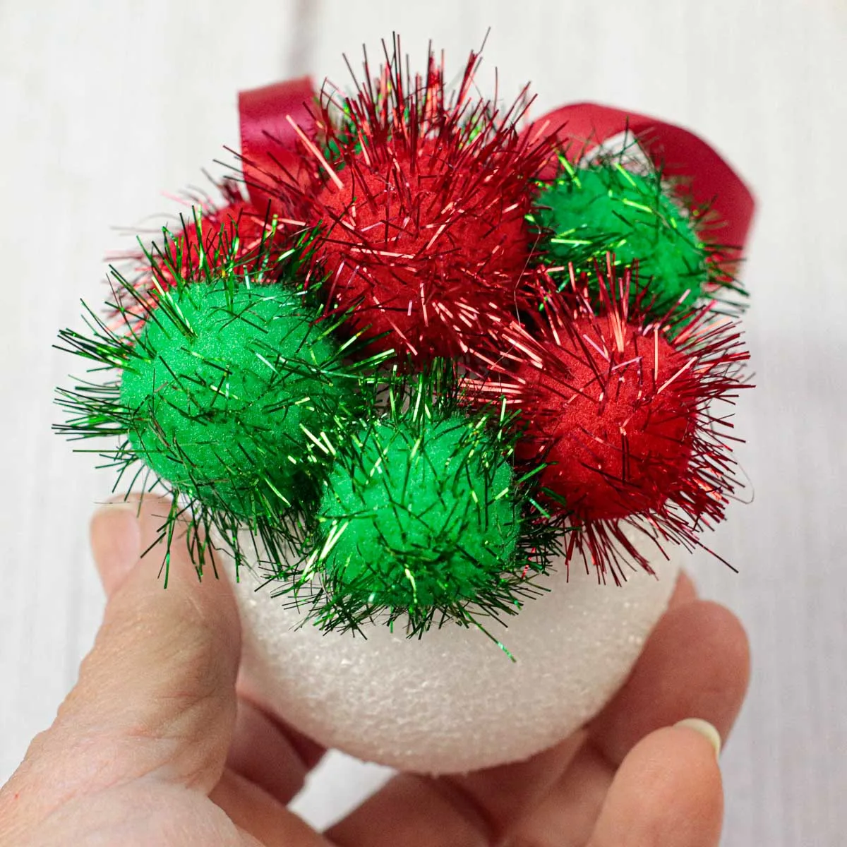 A few Christmas pom poms glued to a Styrofoam ball.