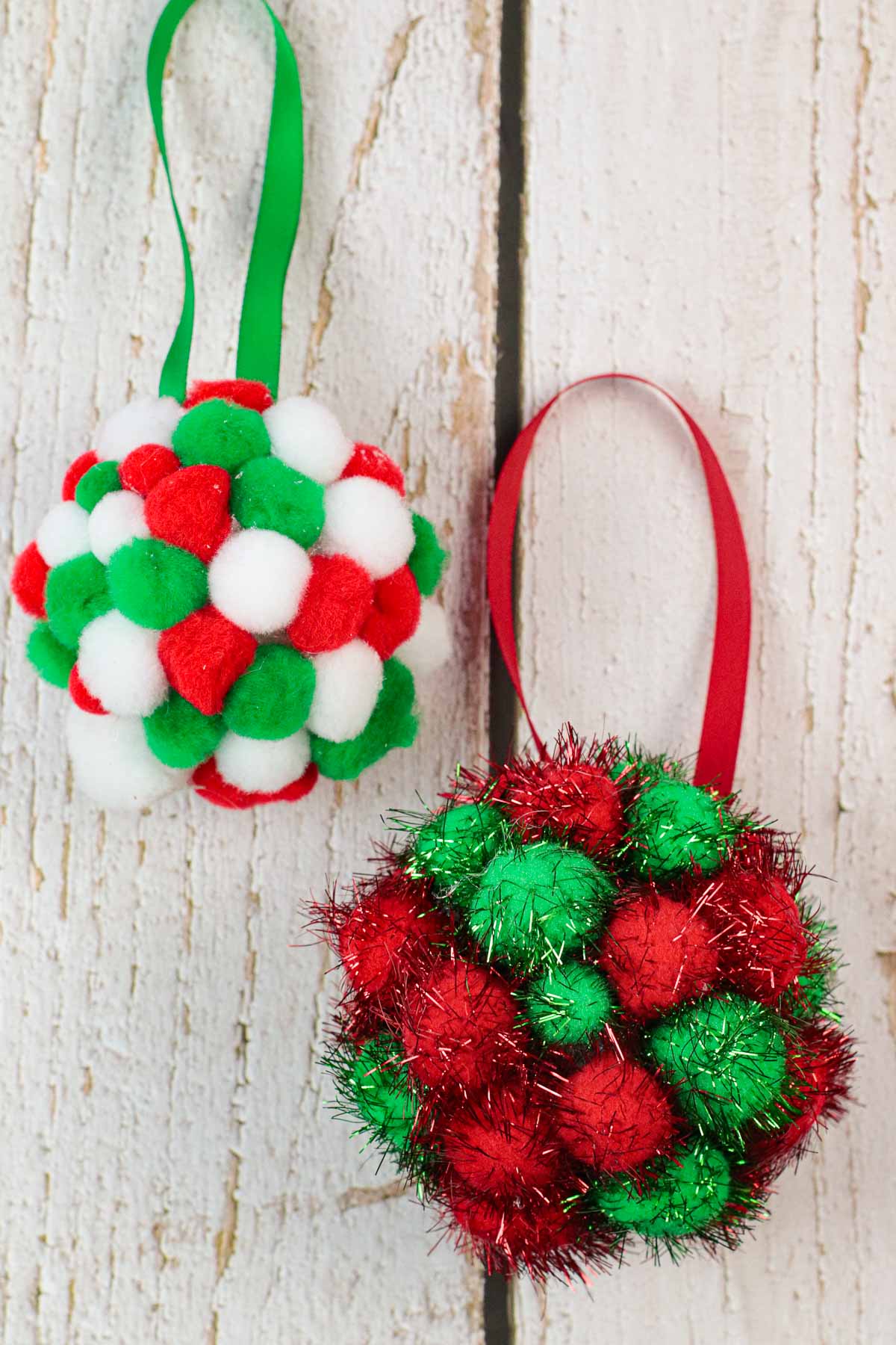 2 DIY pom pom christmas ornaments.