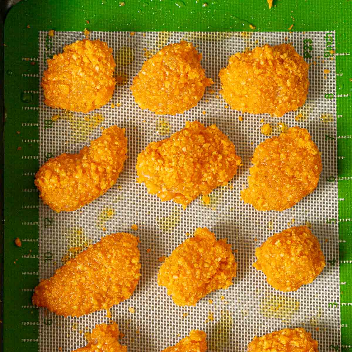 Baking sheet with Cheetos chicken nuggets
